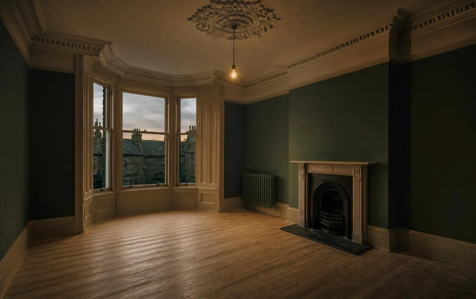 Completed void refurbishment of a pre-1919 Edinburgh tenement room with restored cornicing, cast-iron fireplace and bare timber floor
