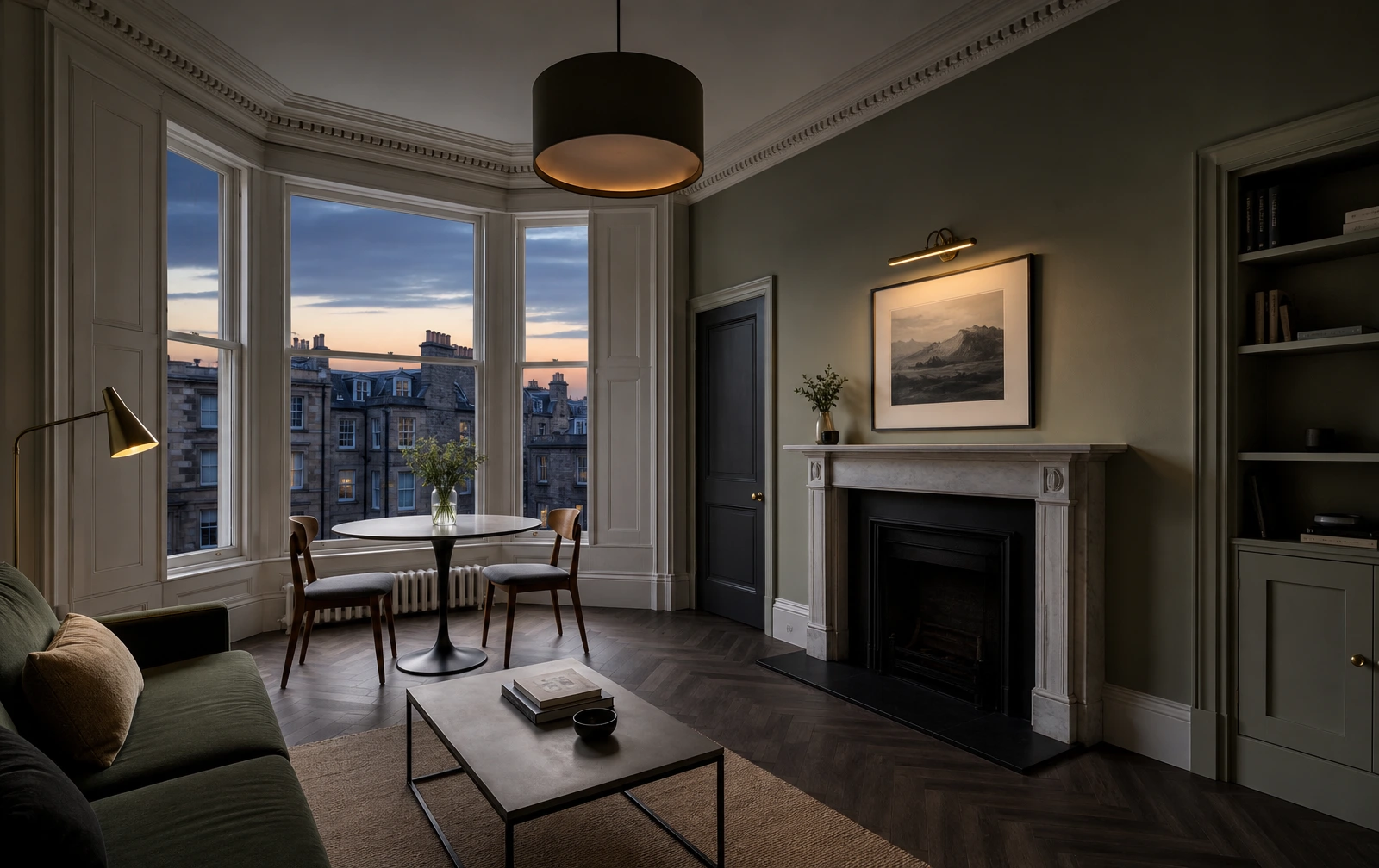 Refurbished Edinburgh tenement living room with bay sash window, cornicing and fireplace at dusk, ready for re-letting